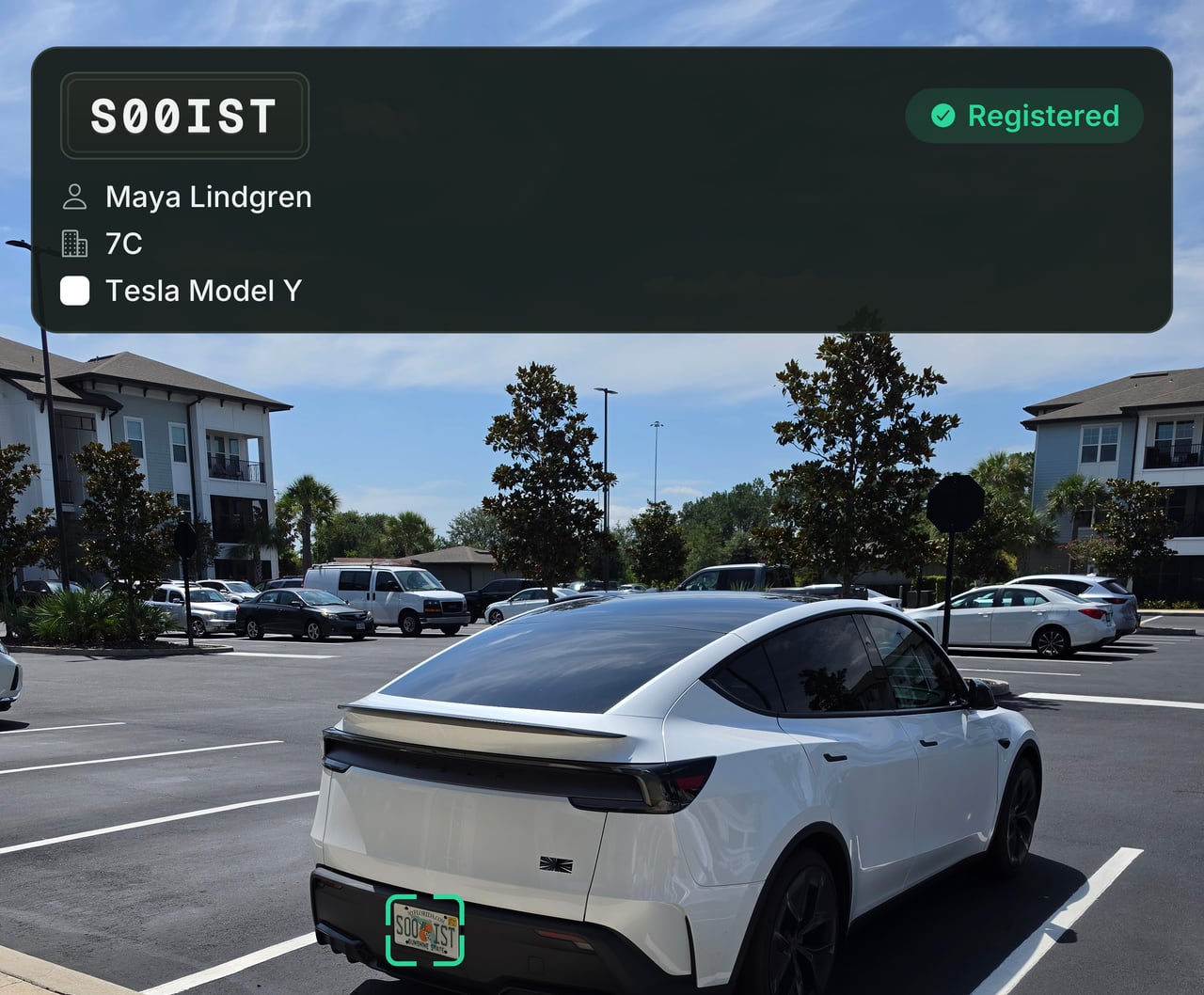A white car in an apartment lot, its plate framed by scanner brackets, with a verdict card reading Registered